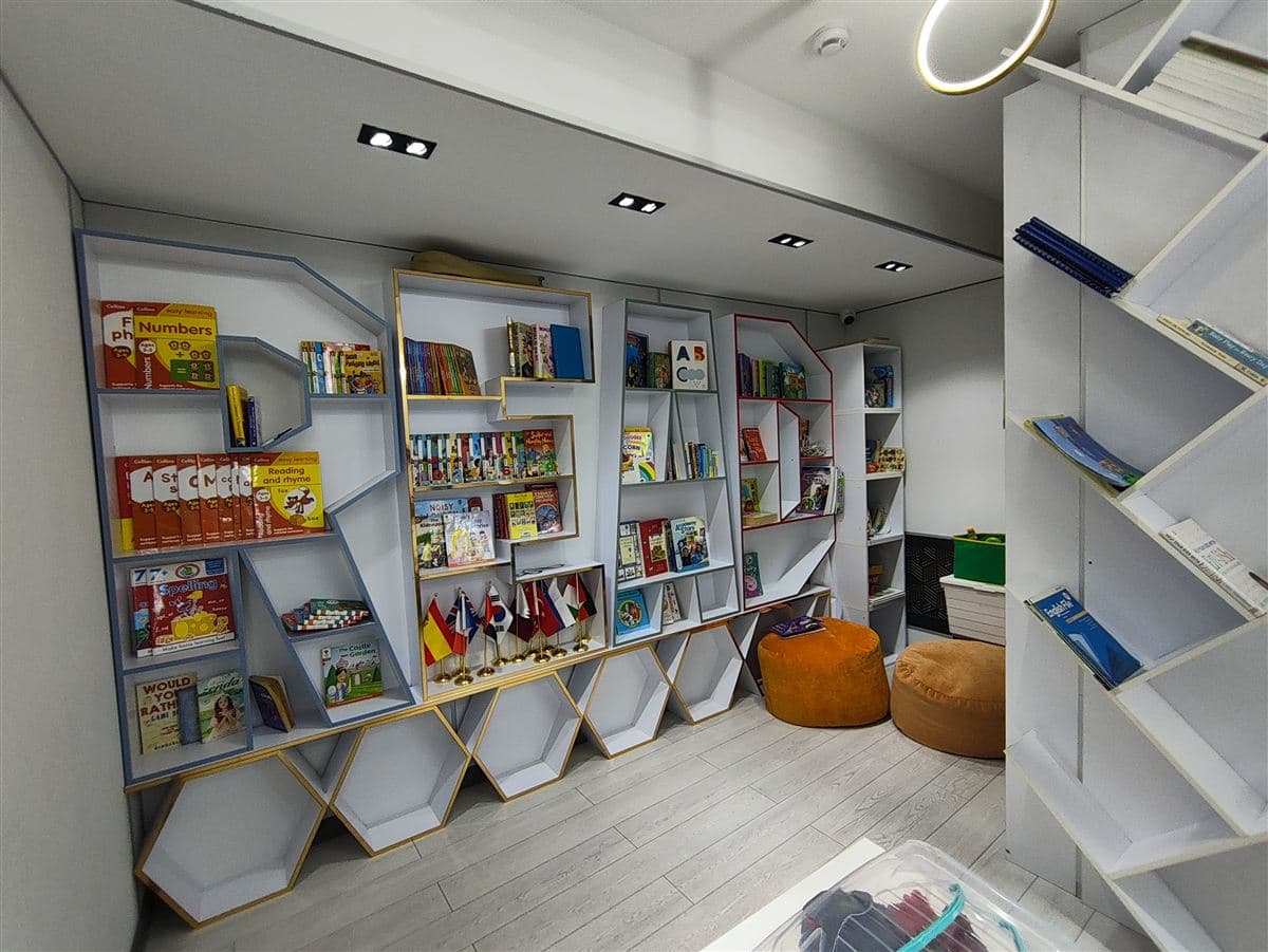 Reading corner with children's books and bean bags at Little Britain Daycare